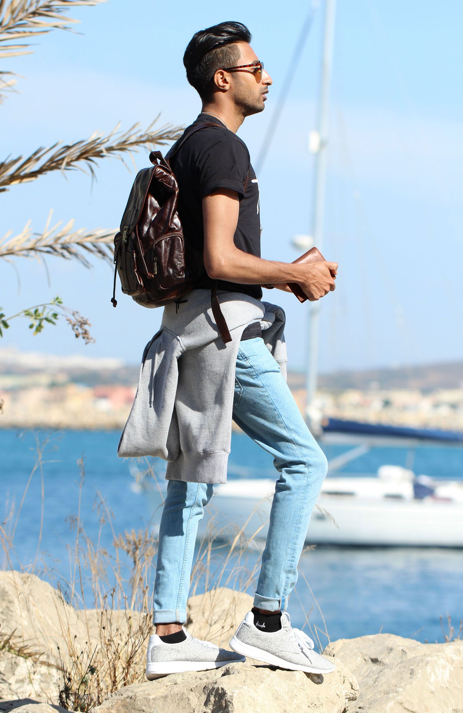 man-in-casual-dress-with-backpack-wallet-and-other-accessories-1600